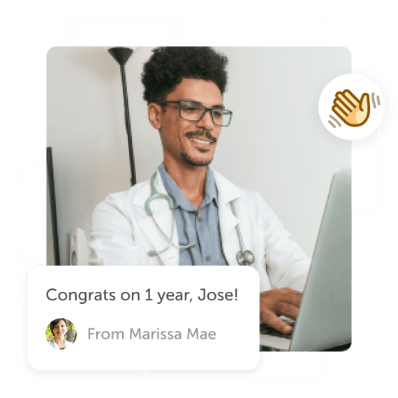 Smiling doctor at laptop with "work anniversary" post