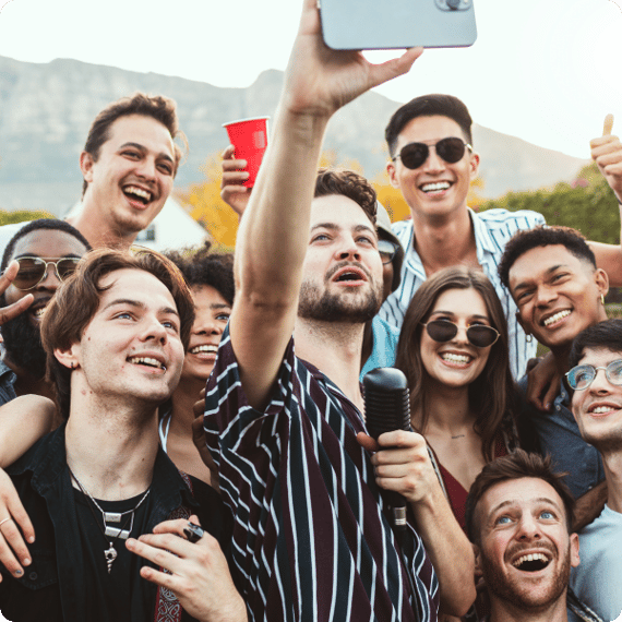Influencer during a community gathering taking picture