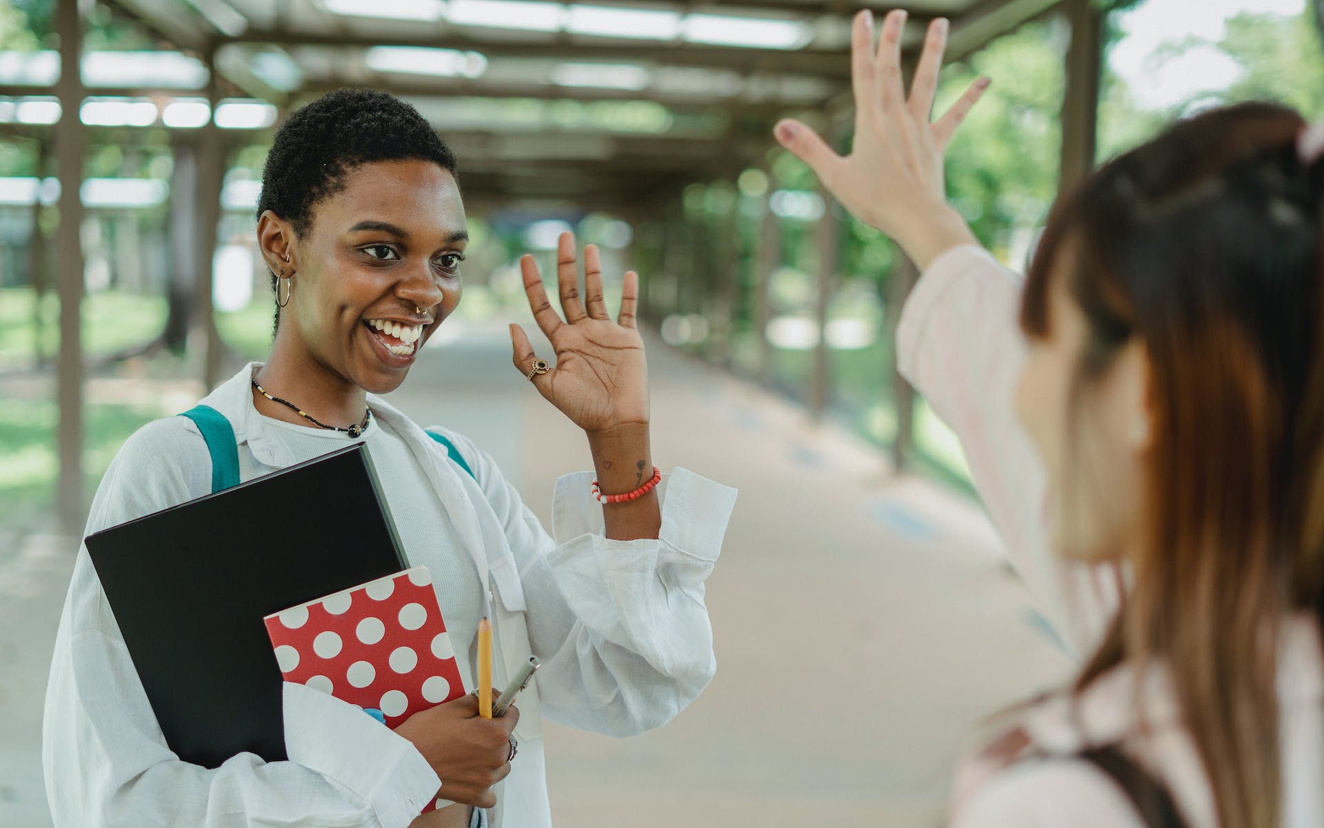 Person waving goodbye to a friend