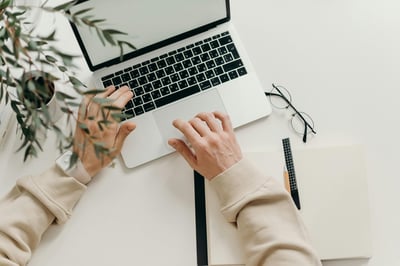 Person using laptop to send eCard via email