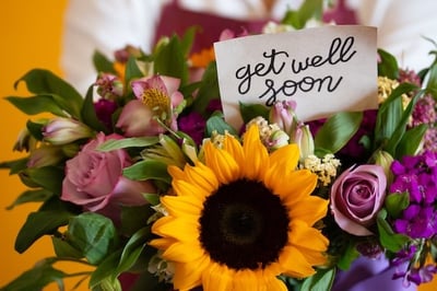 Get well soon card in a colorful bouquet of flowers