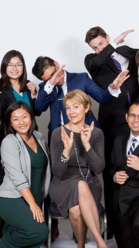 Group of people clapping, posing, and dabbing