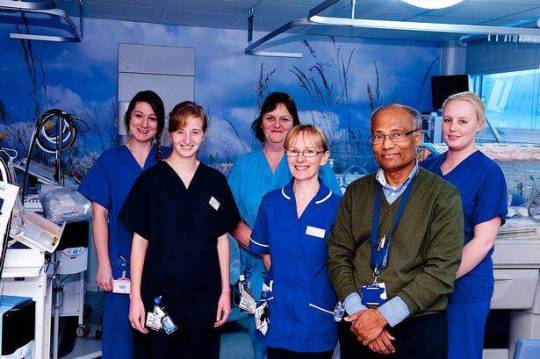 Group of people standing in medical room