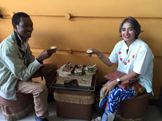 Two people sharing tea in shop