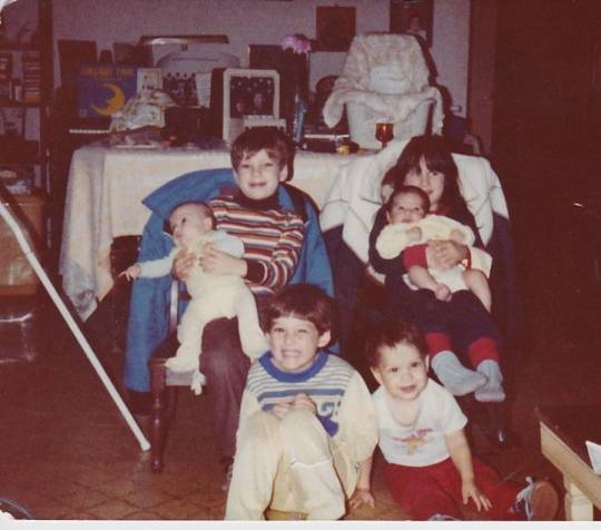 Family and children posing together in photo