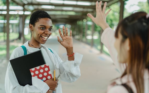 Person waving goodbye to a friend