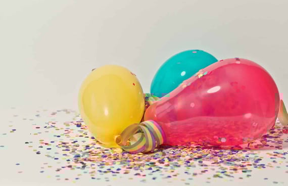 Balloons and confetti on ground