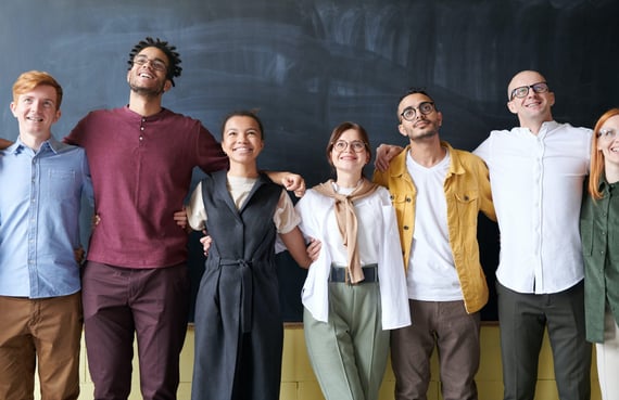 People in a row with arms on shoulders