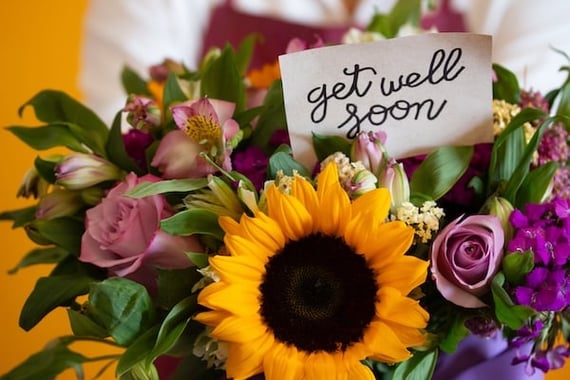 Get well soon card in a colorful bouquet of flowers