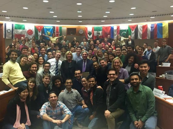 Large group of students in international room posing for photo