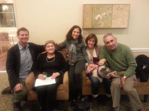 Family sitting together on couch