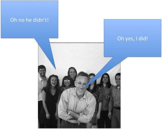Man standing with group of employees