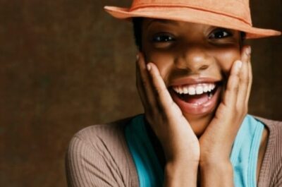 Close up of woman with hands on face