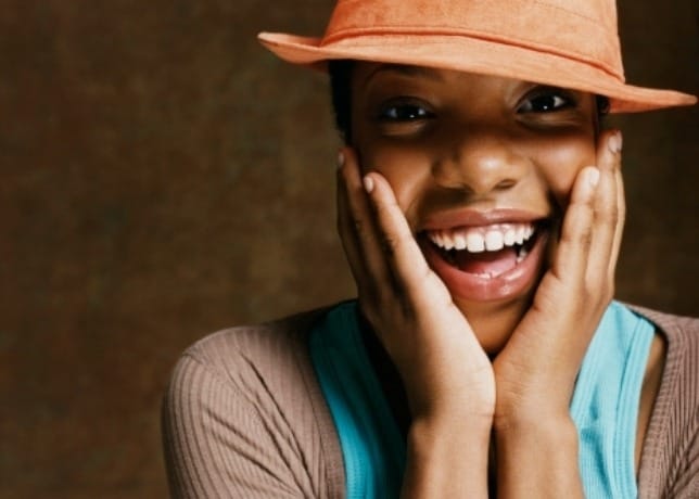 Close up of woman with hands on face