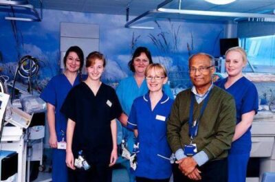 Group of people standing in medical room