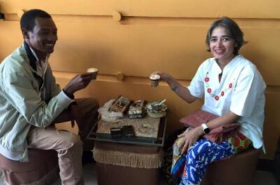 Two people sharing tea in shop