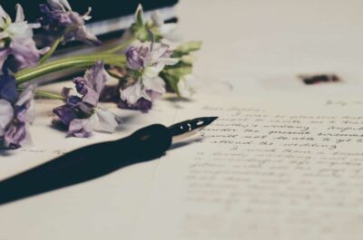 Pen and paper with flowers