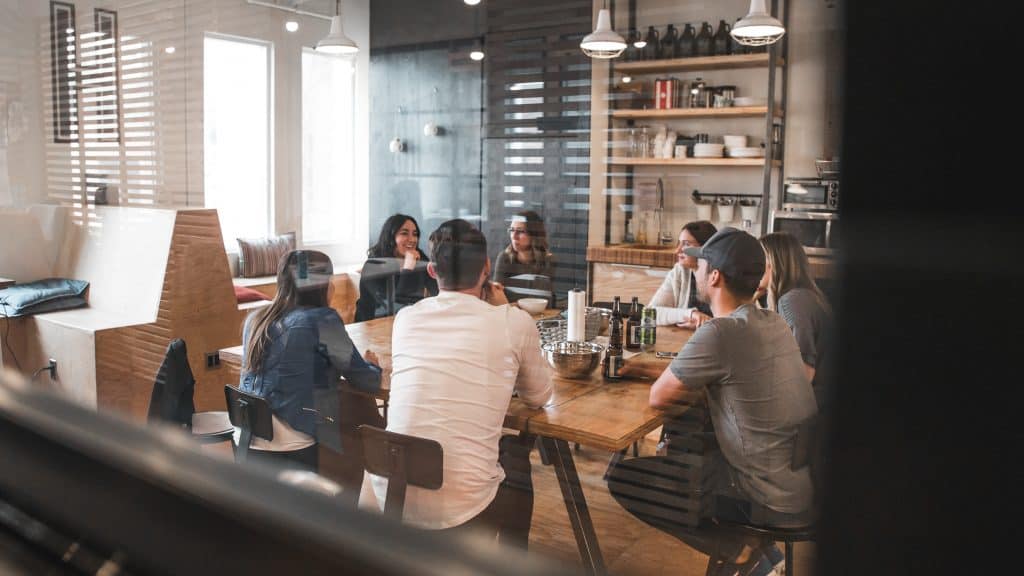 Group of coworkers sitting around table