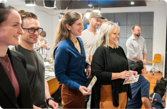 Kudoboard employees working together in meeting room