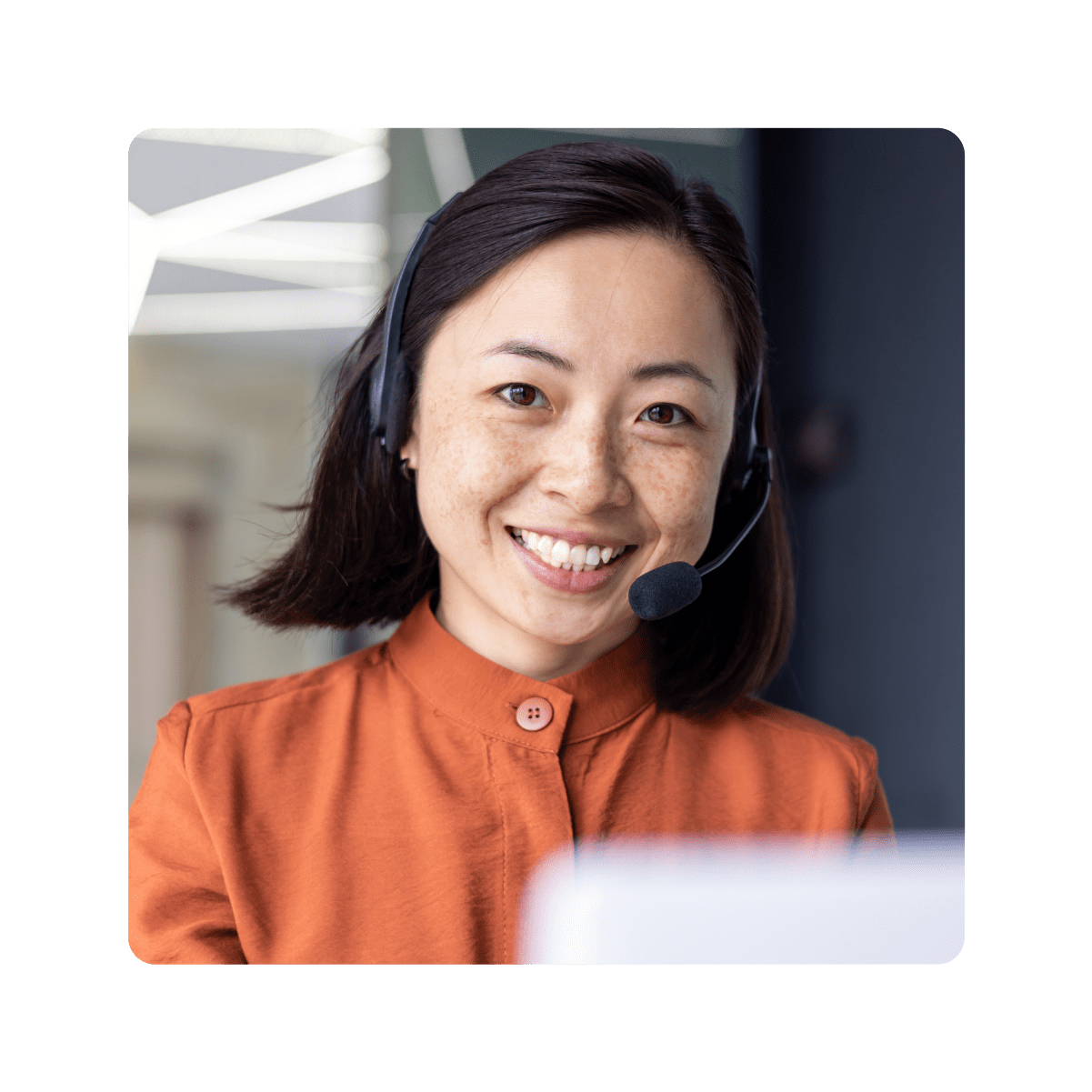 Smiling customer success agent wearing headset