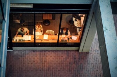 People working in open window at coffeeshop