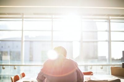 Person working at table in well-lit office