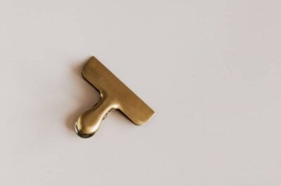 Gold clip sitting on white counter