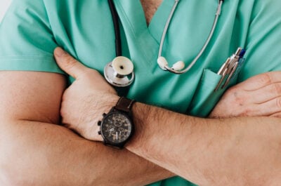 Close up of healthcare worker folding arms