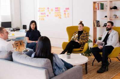 Group of office workers collaborating in circle