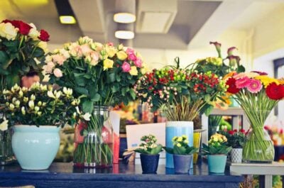 Vases of flower arrangements on table