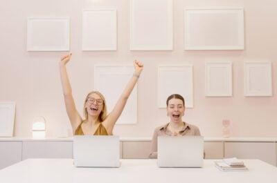 Celebrating employees in front of laptop