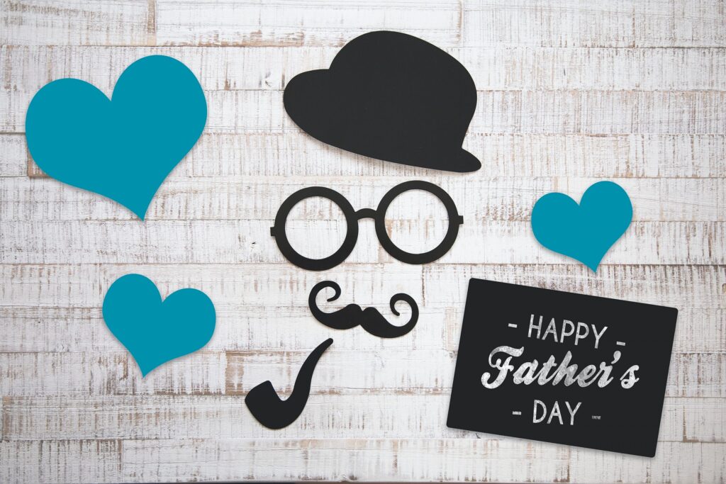 Happy Father's Day card with hearts and mustache icons