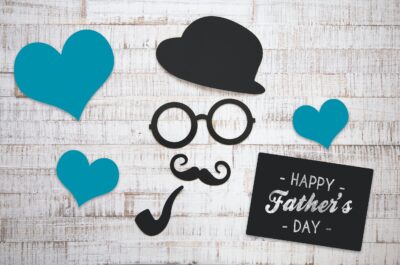 Happy Father's Day card with hearts and mustache icons