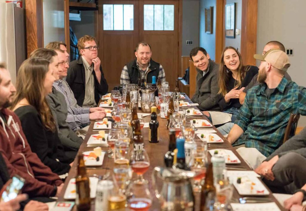 Group of people talking together over dinner