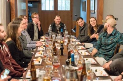 Group of people talking together over dinner