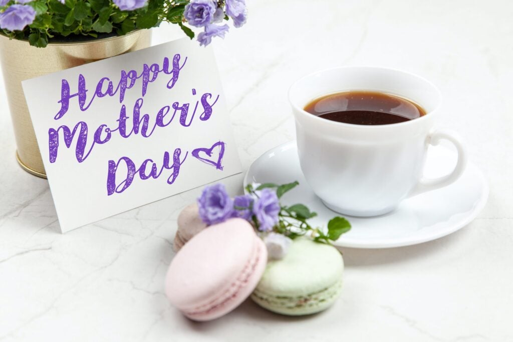 Happy Mother's Day message with macaroons and coffee