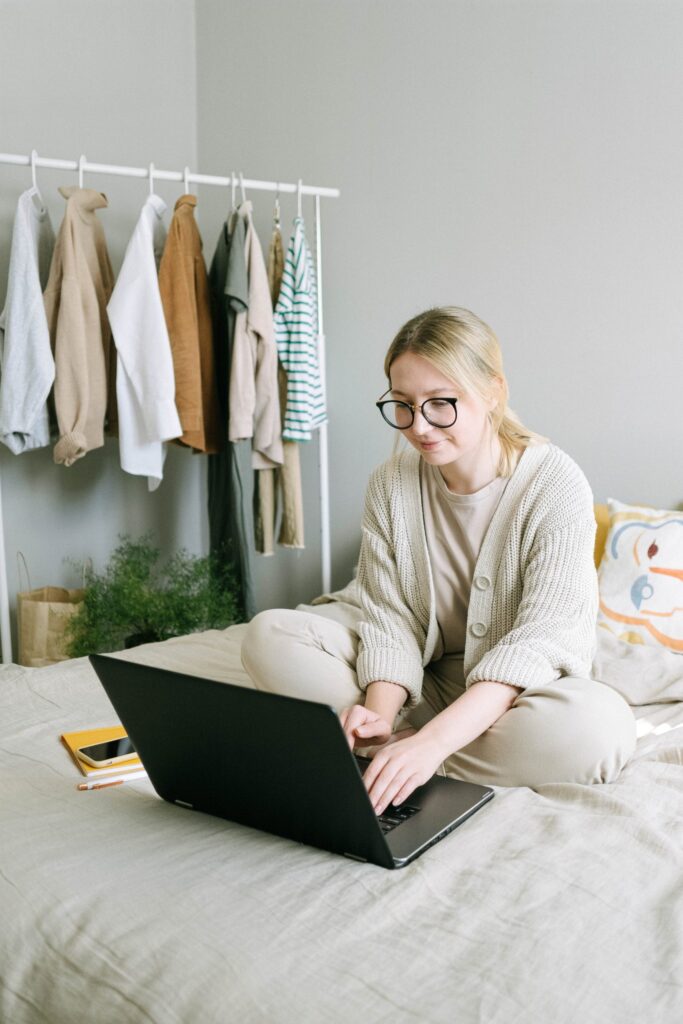 Person working on laptop in bed