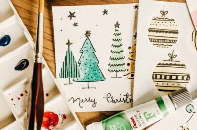 Hand-painted Christmas tree cards with brush and paints