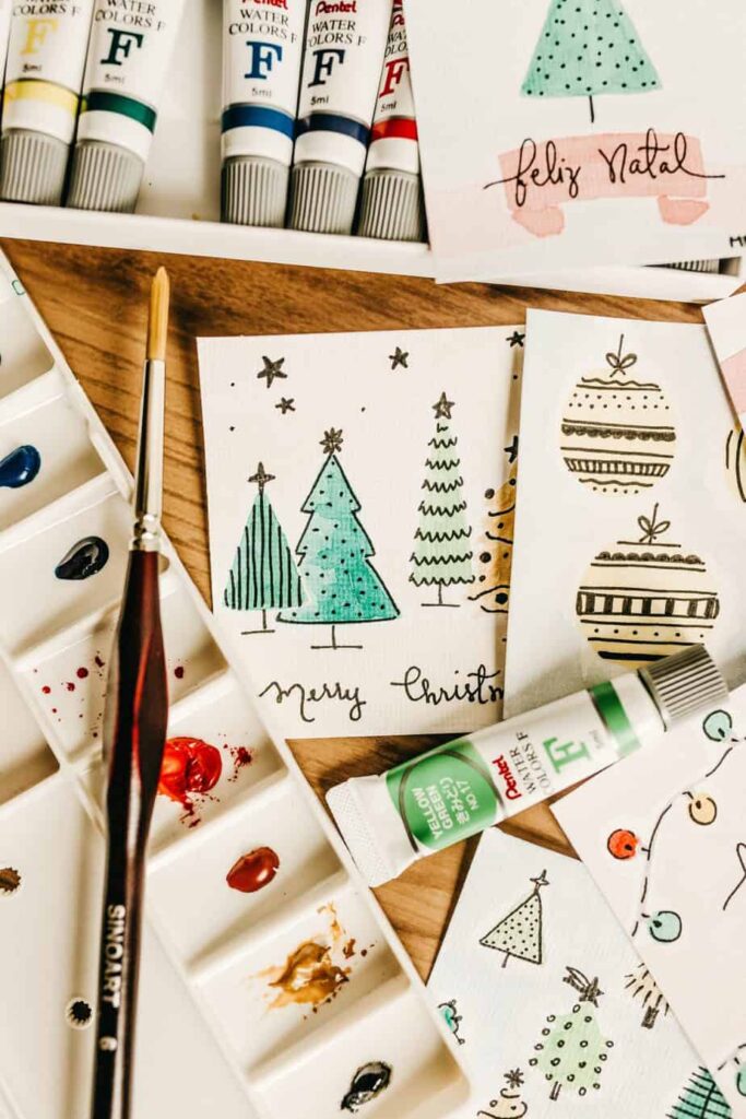 Hand-painted Christmas tree cards with brush and paints