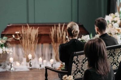 People sitting in rows at funeral