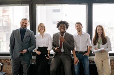 Smiling office workers standing in a row