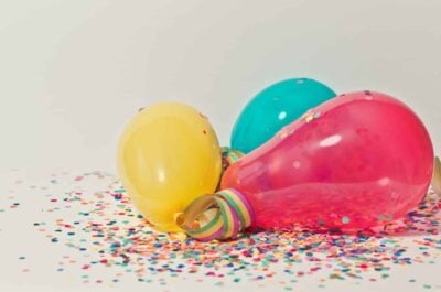 Balloons and confetti on ground