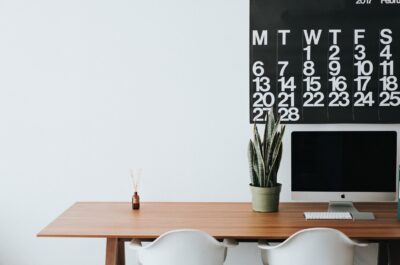 Desk with plant, monitor, and calendar