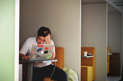 Person working hard in office cubicle