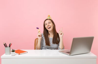 Birthday girl with computer laughing at memes