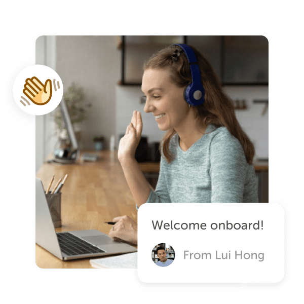 Woman waving to people on laptop with