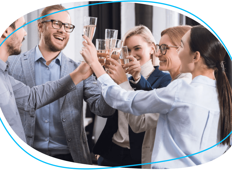 People celebrating a toast with drinks in office