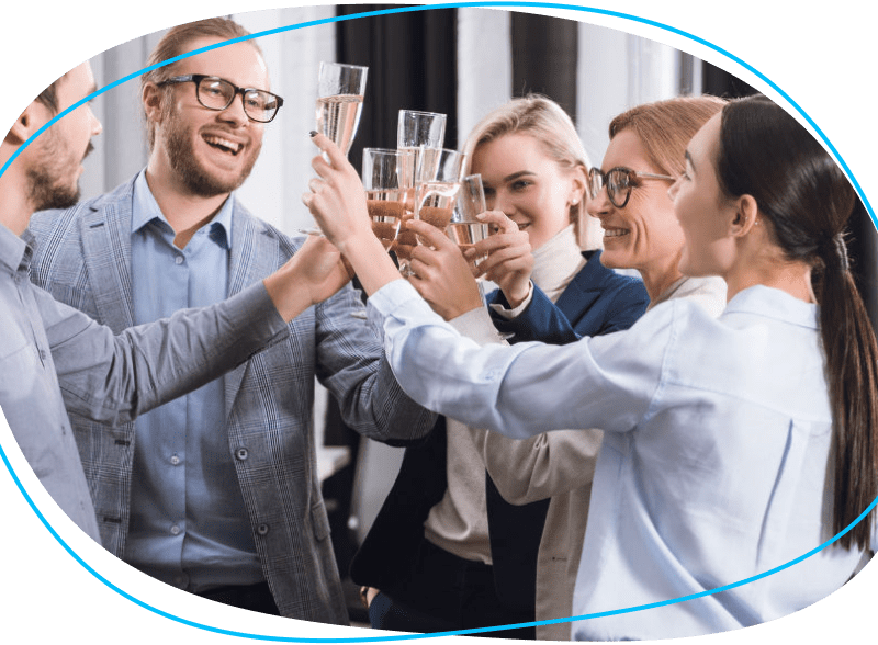 People celebrating a toast with drinks in office