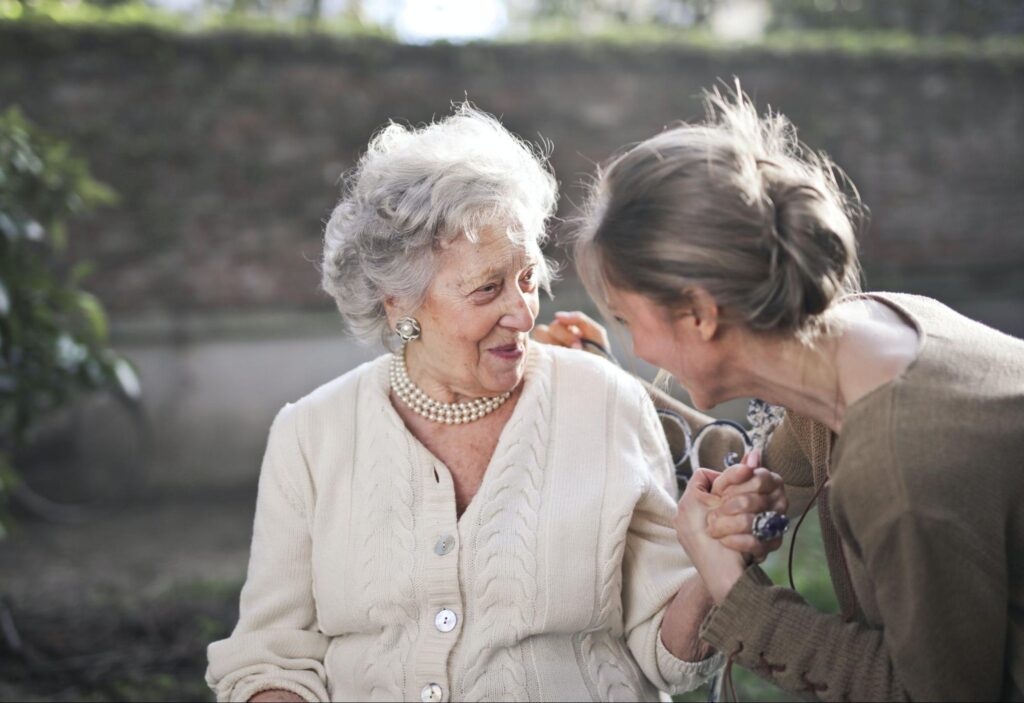 Older woman and younger woman talking together