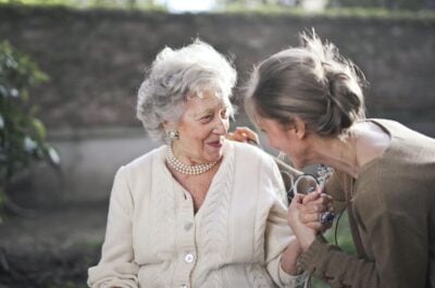 Older woman and younger woman talking together